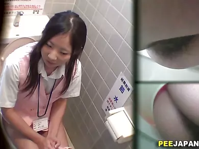 Asian slut pees in toilet